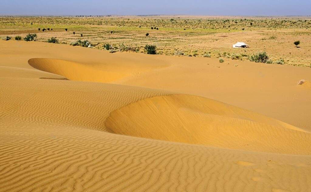 Sand dunes white tent SAM dunes Desert National Park of Thar Desert of India with copy space transformed