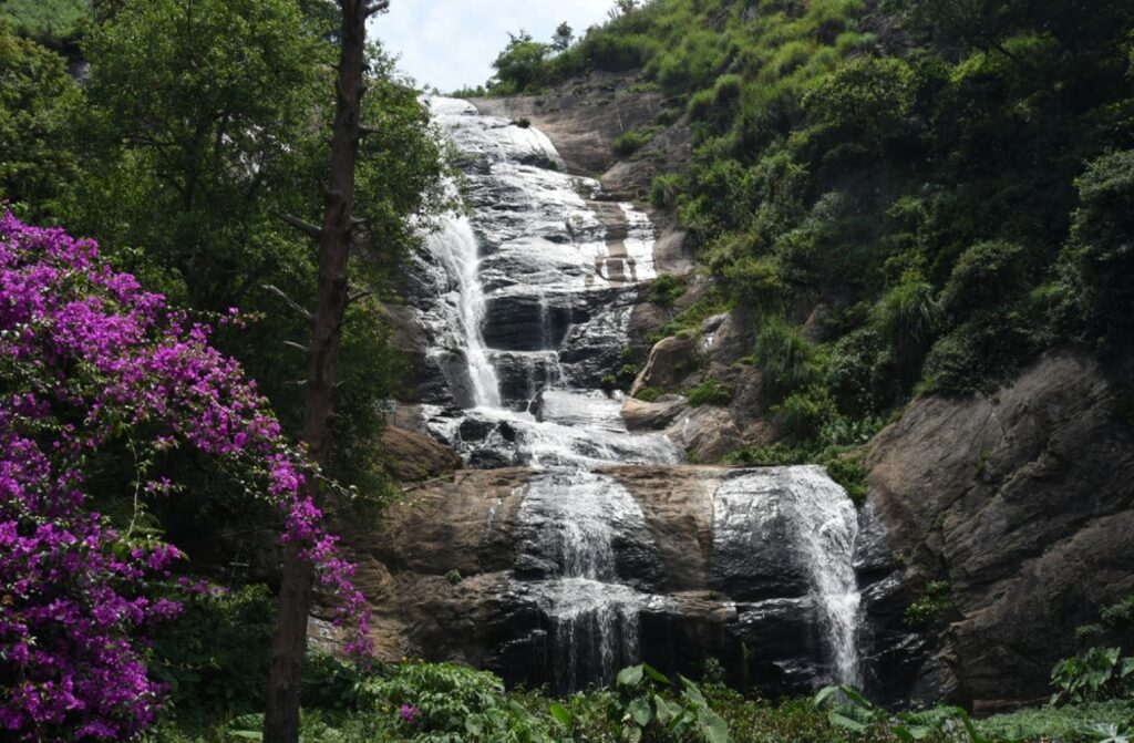 Picturesque view of Bear Shola Falls, a mesmerizing waterfall nestled in the serene surroundings of Kodaikanal, Tamil Nadu.