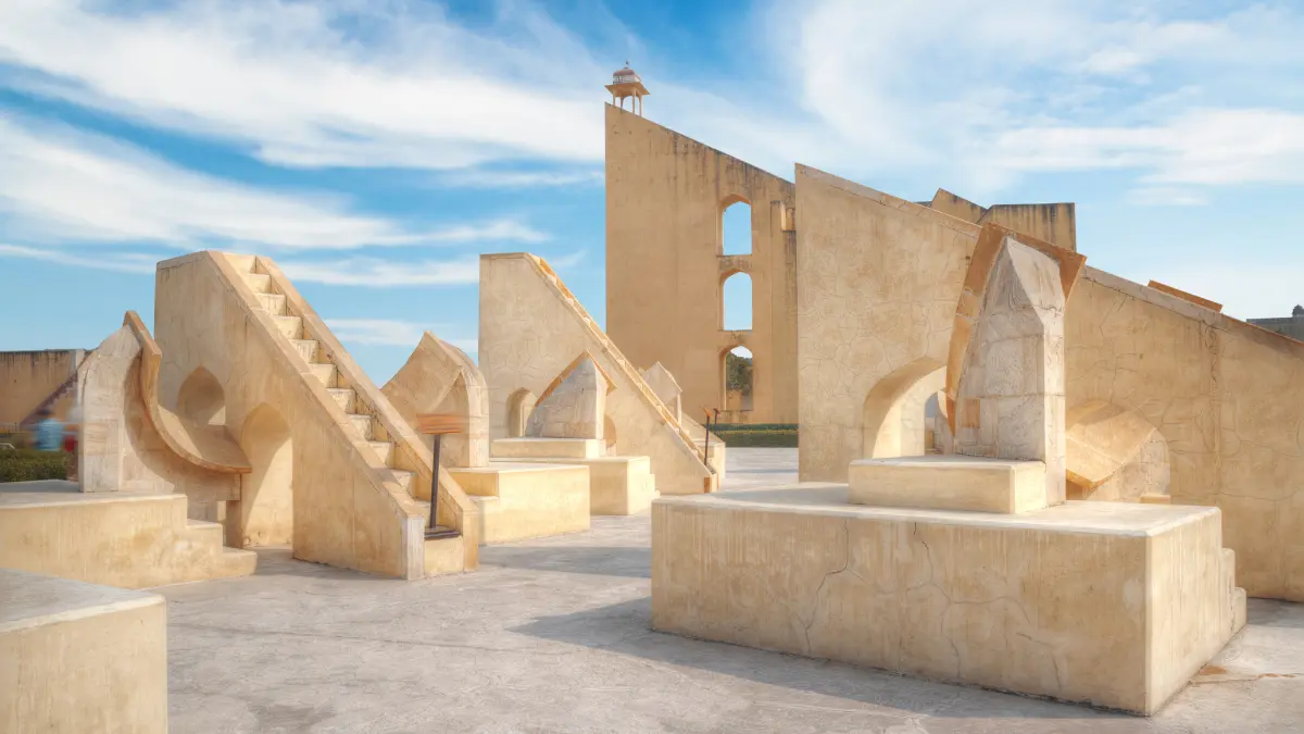 A photograph of Delhi's 18th-century astronomical observatory, Jantar Mantar. The observatory contains a number of instruments that are used to track the movement of the sun, moon, and stars.